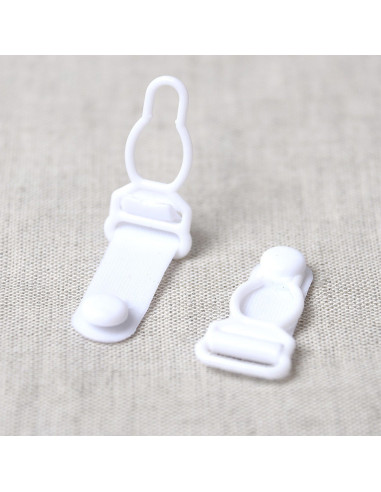 Set de 4 boucles porte jarretelle en plastique - Blanc