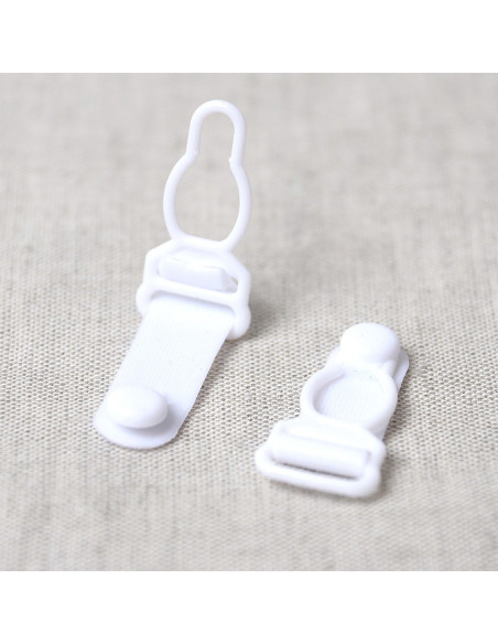 Set de 4 boucles porte jarretelle en plastique - Blanc