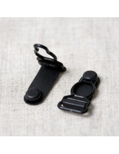 Set de 4 boucles porte jarretelle en plastique - Noir